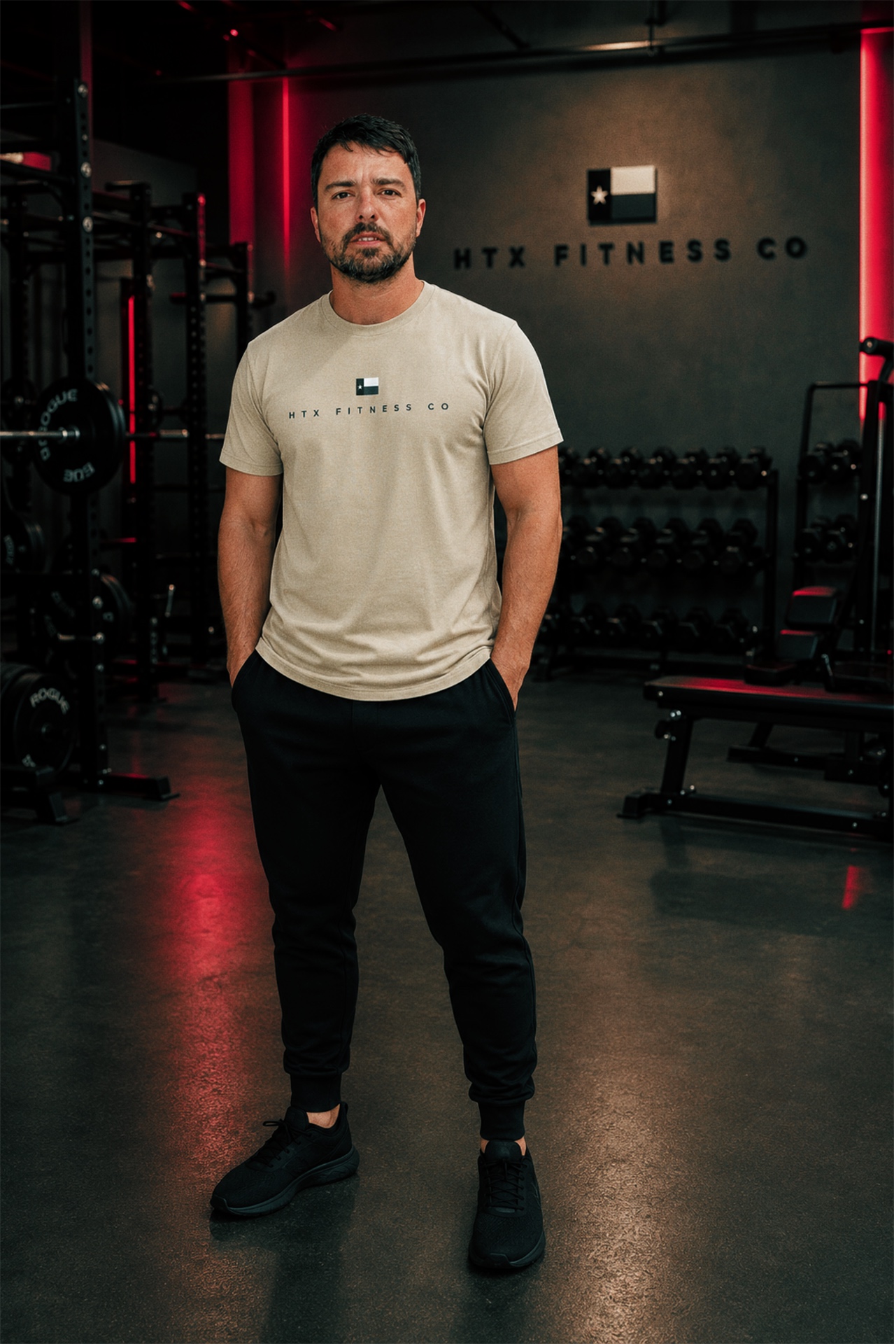 Athlete training in an HTX Fitness Co. tee inside the gym