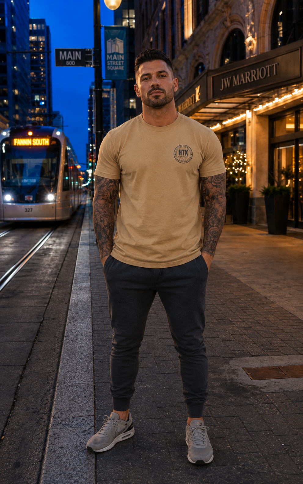 Model wearing an HTX Fitness Co. tee on Main Street in downtown Houston